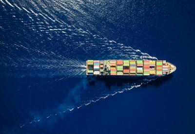 cargo ship cutting through water